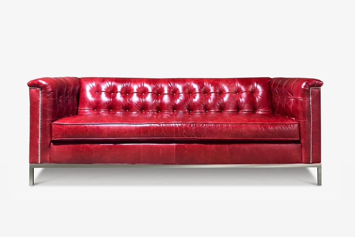 Neil Mid-Century Sofa in Cranberry Leather Shown with Optional Square Tufting & Stainless Steel Legs