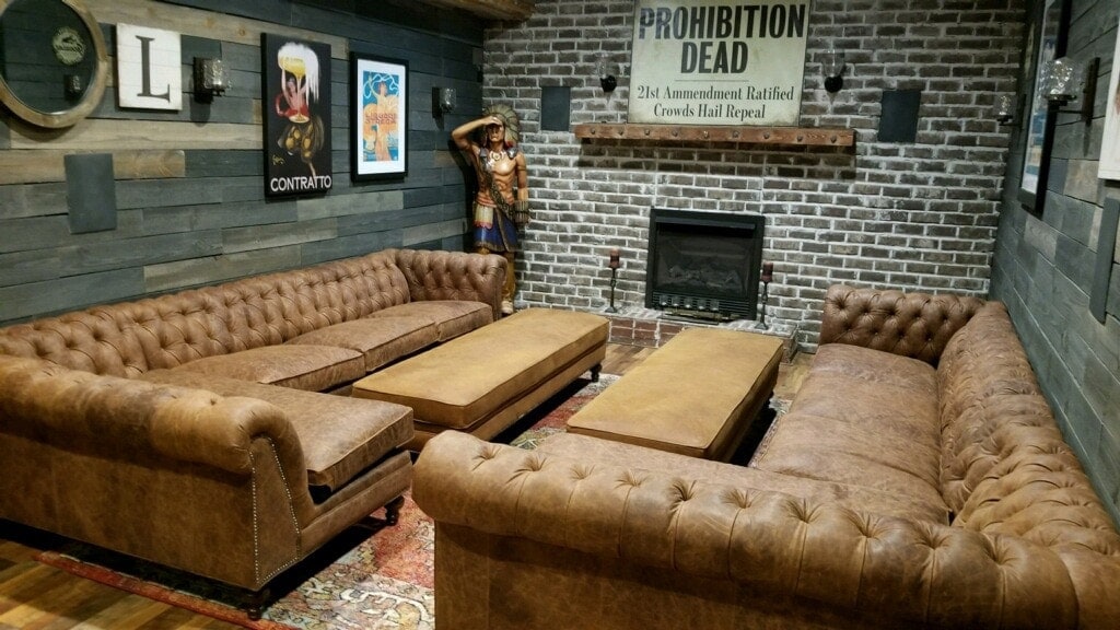 A Man-Cave's Hemingway Chesterfield Sectional Set in Rustic Cigar Brown Leather Paired with Bespoke Caramel Leather Ottomans